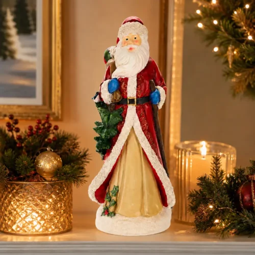 Babbo natale con albero in spalla H 39 cm