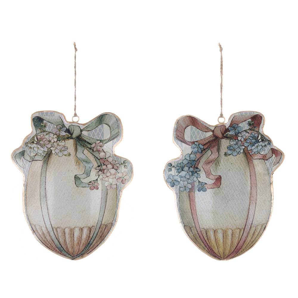 Coppia di uova di Pasqua in metallo decorate con fiocchi e fiori, perfette da appendere.