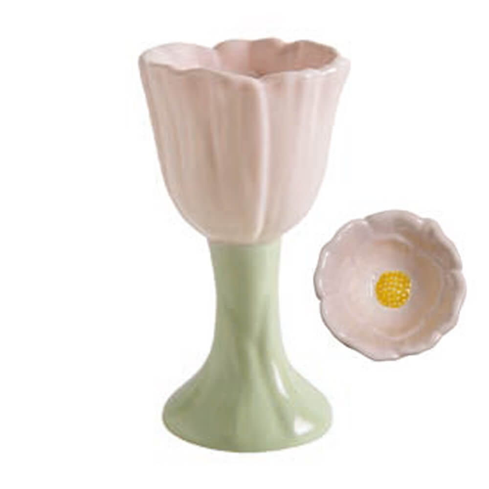 Portauovo in ceramica rosa chiaro a forma di tulipano con base verde pastello, elegante e decorativo.