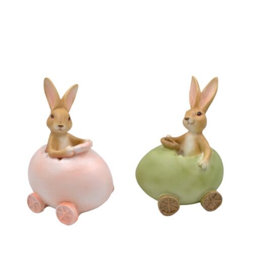 Decorazione pasquale in resina con coniglietto dentro un uovo su ruote, disponibile in rosa e verde.