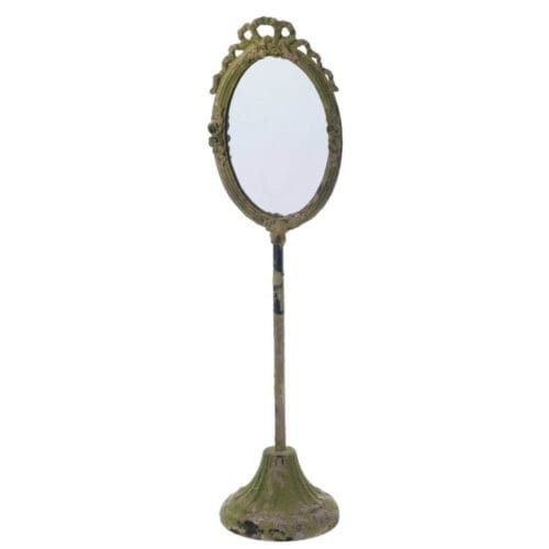 Specchio ovale con cornice verde antichizzata e base in metallo, decorazione con fiocco e fiori.