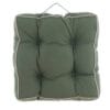 Cuscino da sedia verde con impunture centrali, profilo beige a contrasto e manico per appenderlo.