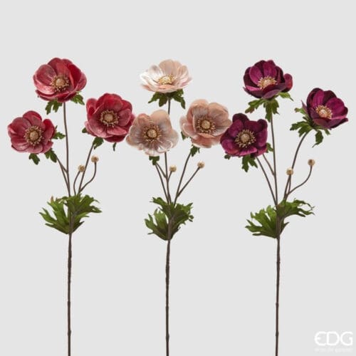 Rami decorativi con anemoni in velluto e foglie verdi, disponibili nei toni malva, rosa e viola.