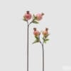 Ramo artificiale con due melograni rosa e foglie verdi, effetto realistico, su sfondo neutro.