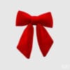 Fiocco rosso in velluto EDG, di dimensioni contenute e tessuto morbido. Perfetto per pacchi regalo o dettagli decorativi.