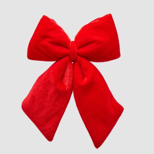 Fiocco decorativo rosso in velluto, di piccole dimensioni, perfetto per pacchetti o addobbi.