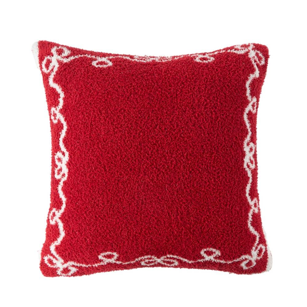 Cuscino rosso natalizio Blanc MariClo in sherpa con bordi smerlati e decori jacquard bianchi a fiocco. Misura 45x45 cm.