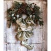 Calza di Natale verde in velluto con fiocco in organza e dettagli decorativi brillanti, appesa a una porta decorata con ghirlanda natalizia.