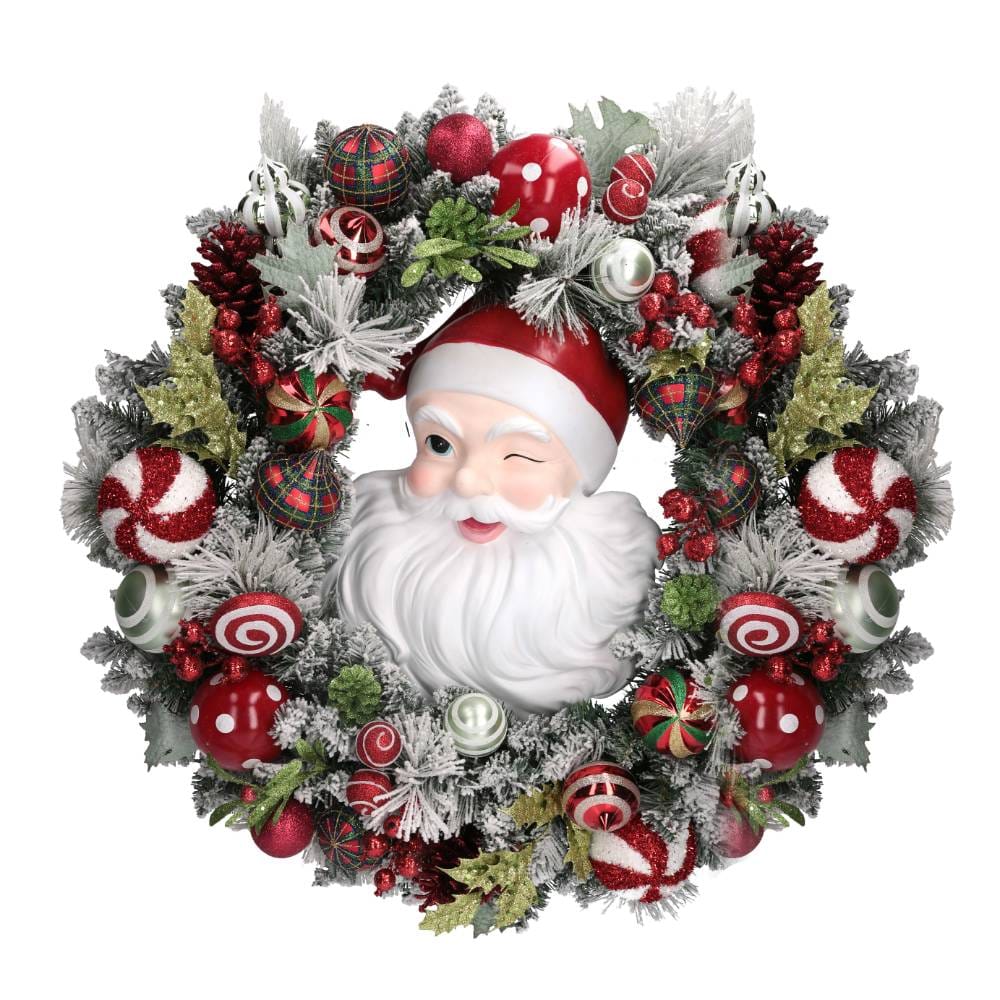 Guirnalda navideña con la cara de Papá Noel, bolas cubiertas de nieve y piñas