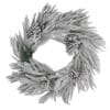 corona natalizia innevata con pigne