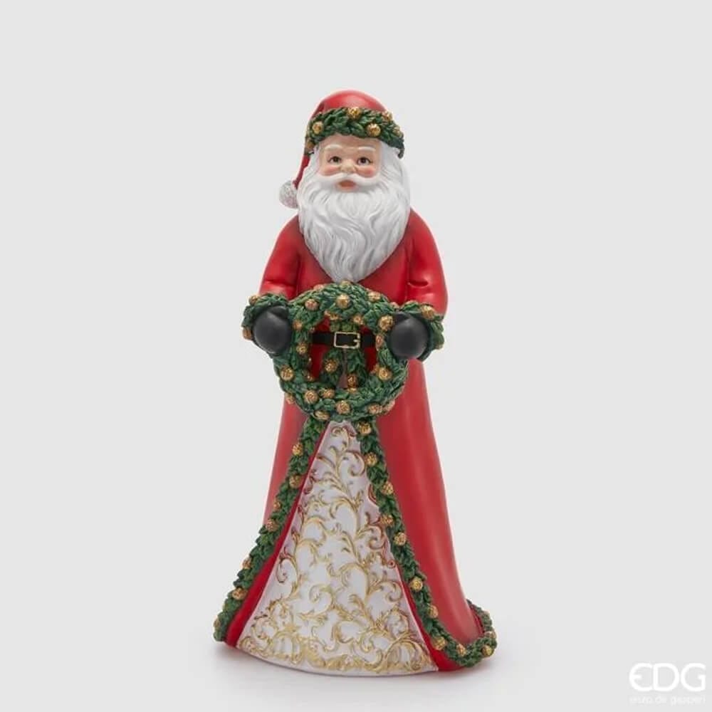 Statue de Noël en polyrésine représentant le Père Noël avec une guirlande verte et un manteau rouge, avec des décorations dorées.