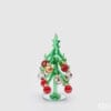 Mini albero di Natale in vetro verde con base specchiata e palline colorate rosse, bianche e oro, fornito in scatola bianca con logo EDG.