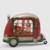 Carillon natalizio EDG a forma di camper rosso e verde con scena interna di Babbo Natale e Mamma Natale, decorato con luci e neve artificiale.