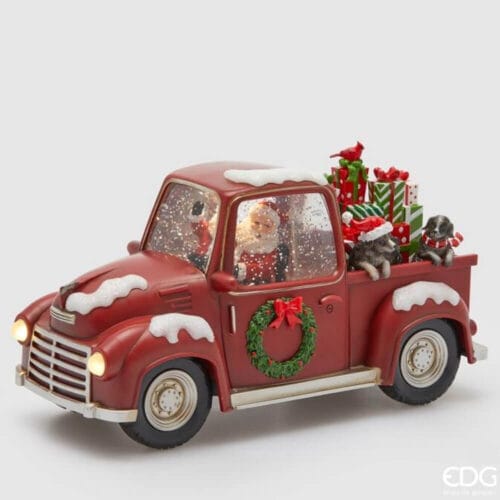 Carillón navideño de Enzo De Gasperi en el que aparece Papá Noel en una furgoneta roja cargada de regalos y cachorros, decorada con nieve, LED y una guirnalda verde.