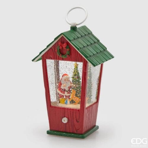 Carillon natalizio a forma di casetta con tetto verde, Babbo Natale, albero di Natale e neve glitterata, con luci LED e musica.