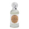 Flacone in vetro trasparente lavorato con tappo decorativo e etichetta color albicocca, contenente il profumo per tessuti Mathilde M Fleur de Mandarine.