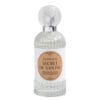 Flacone trasparente in vetro lavorato con tappo decorativo e etichetta color beige, contenente il profumo per tessuti Mathilde M Secret de Santal.