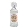 Flacone in vetro trasparente con tappo a rilievo e etichetta beige chiaro, contenente profumo per tessuti Mathilde M Sublime Jasmin.