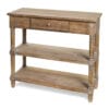 Consolle shabby chic in legno naturale con cassetto centrale, due ripiani aperti e gambe tornite, ideale come mobile d’ingresso o complemento d’arredo.