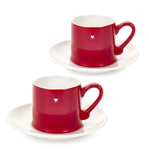 Coppia di tazzine da caffè in porcellana rossa con cuore bianco e piattino abbinato bianco, stile natalizio.