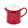 Teiera in porcellana rossa con coperchio bianco e pomello a cuore, decorata con piccolo cuore bianco.