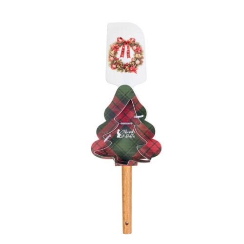 Set natalizio con spatola decorata da ghirlanda rossa e stampino a forma di albero, su confezione scozzese sagomata.
