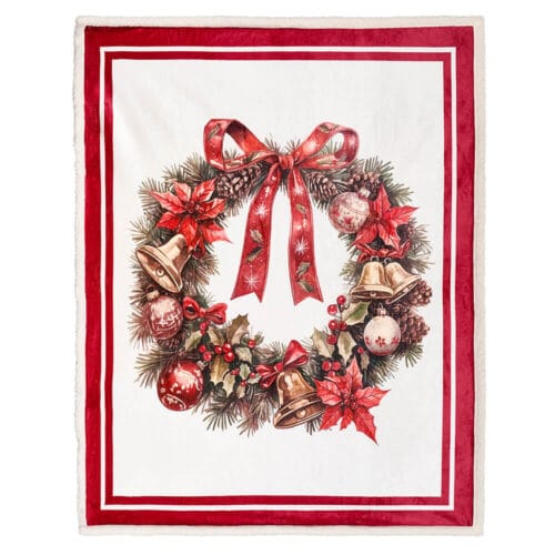 Plaid natalizio in pile con stampa di ghirlanda rossa e dorata, bordi rossi e retro effetto pelliccia, confezionato in una scatola regalo decorata.