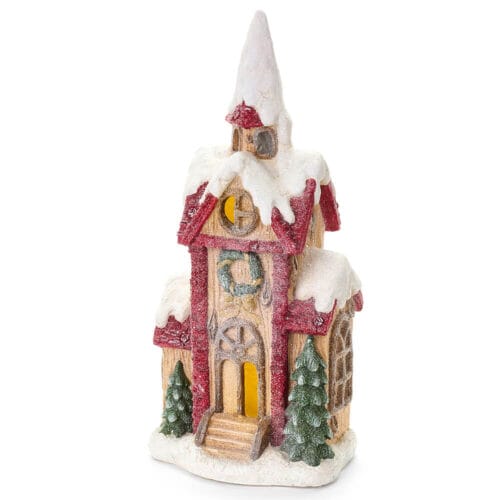 Casa natalizia in resina con tetti innevati e luci LED calde, collezione Storia di Natale.