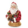 Statua decorativa in resina di Babbo Natale con regali, rifinita nei dettagli con base dorata.