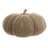 Grande zucca decorativa in velluto beige con applicazioni di perline dorate e gambo dorato, in stile elegante.