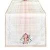 Runner natalizio in cotone con fantasia a quadri rosa e crema, decorato con campanelle, fiocco rosa e rametti verdi, bordi beige.