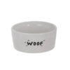 Ciotola in ceramica bianca con scritta “WOOF” in nero, ideale per cibo o acqua per cani.