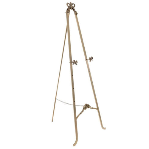 Cavalletto in metallo dorato con dettagli a fiocco, alto 130 cm, firmato Blanc Mariclò, perfetto per esposizioni eleganti.