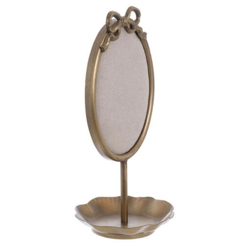 Porta gioielli Blanc Mariclò con cornice ovale in metallo, tessuto beige e fiocco decorativo sulla sommità.