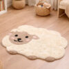 Tappeto Blanc Mariclò a forma di pecorella color crema e beige, morbido e decorativo