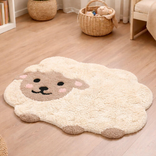 Tappeto Blanc Mariclò a forma di pecorella color crema e beige, morbido e decorativo