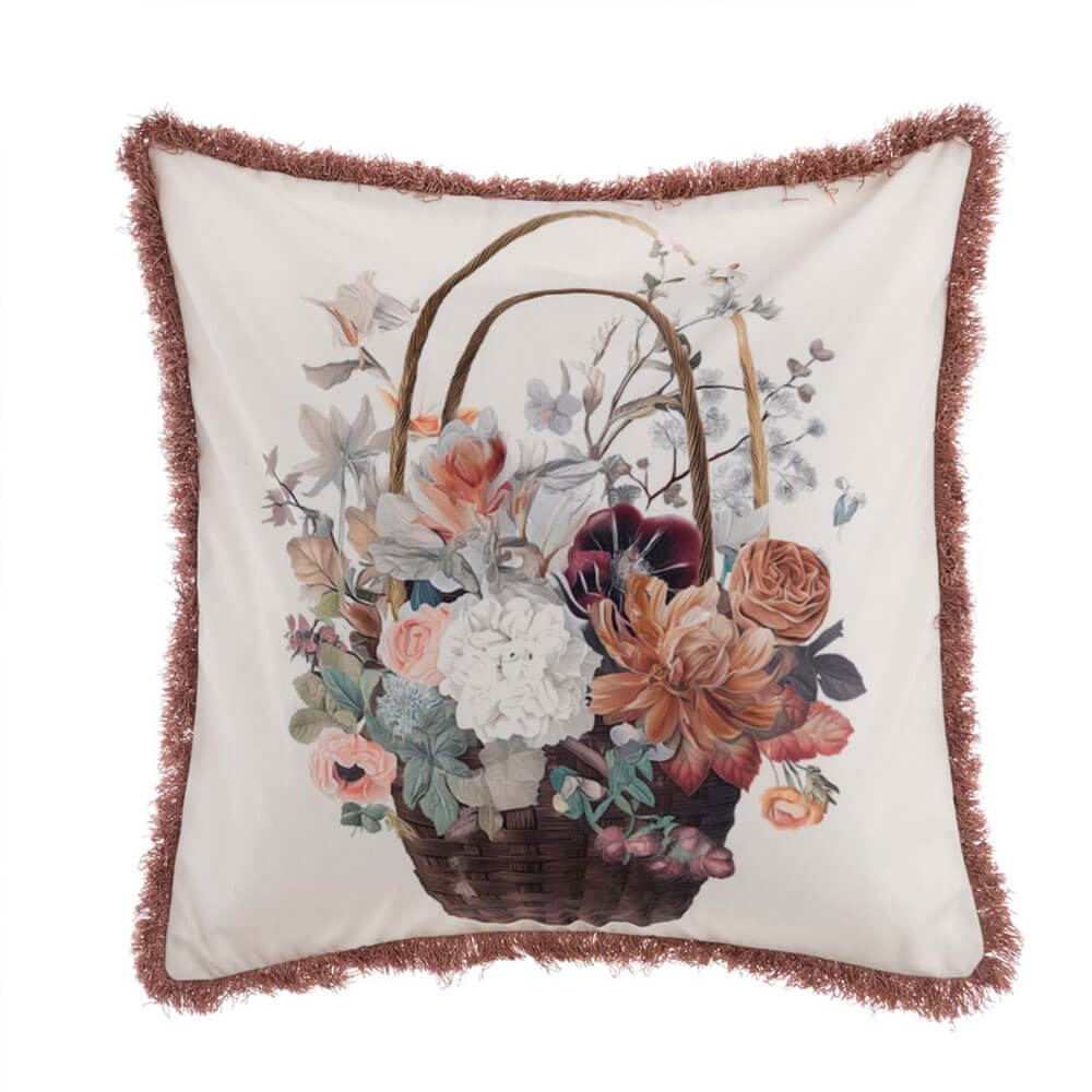 Cuscino Blanc Mariclò in velluto con stampa floreale a cesto di fiori e bordo rifinito con frange decorative.