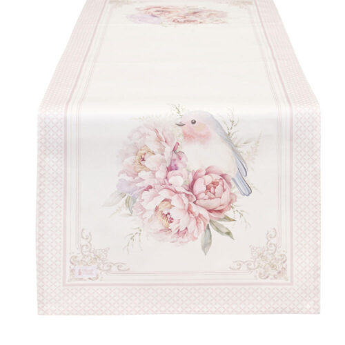 Chemin de table Nuvole di Stoffa Fiorirà Uccellino 50x150 en coton ivoire, avec petit oiseau et pivoines roses au centre, cadre décoré et bordure en losanges roses.
