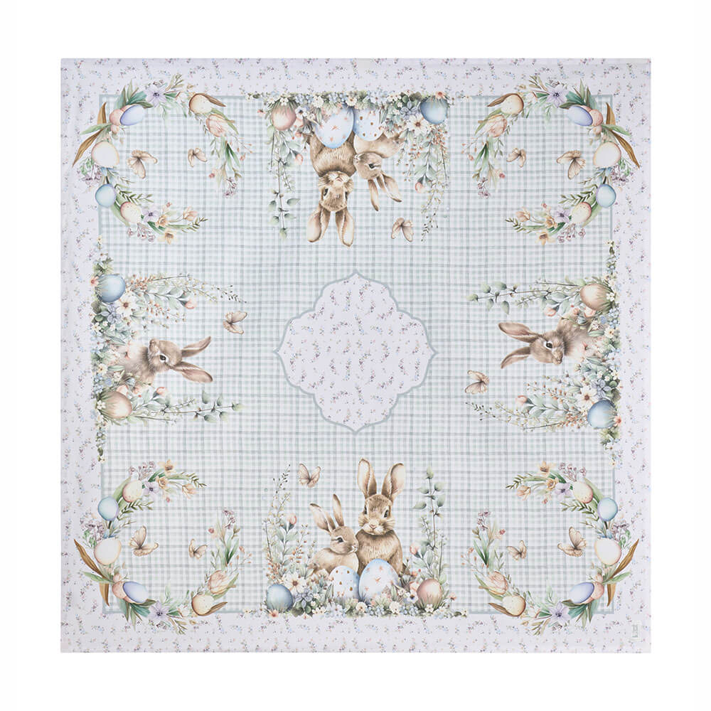 Nuvole di Stoffa Centro Tavola Pepen 120x120 cm 1 Centro tavola in cotone Nuvole di Stoffa con coniglietti pasquali, uova decorate e fiori su fondo a quadretti verde chiaro.