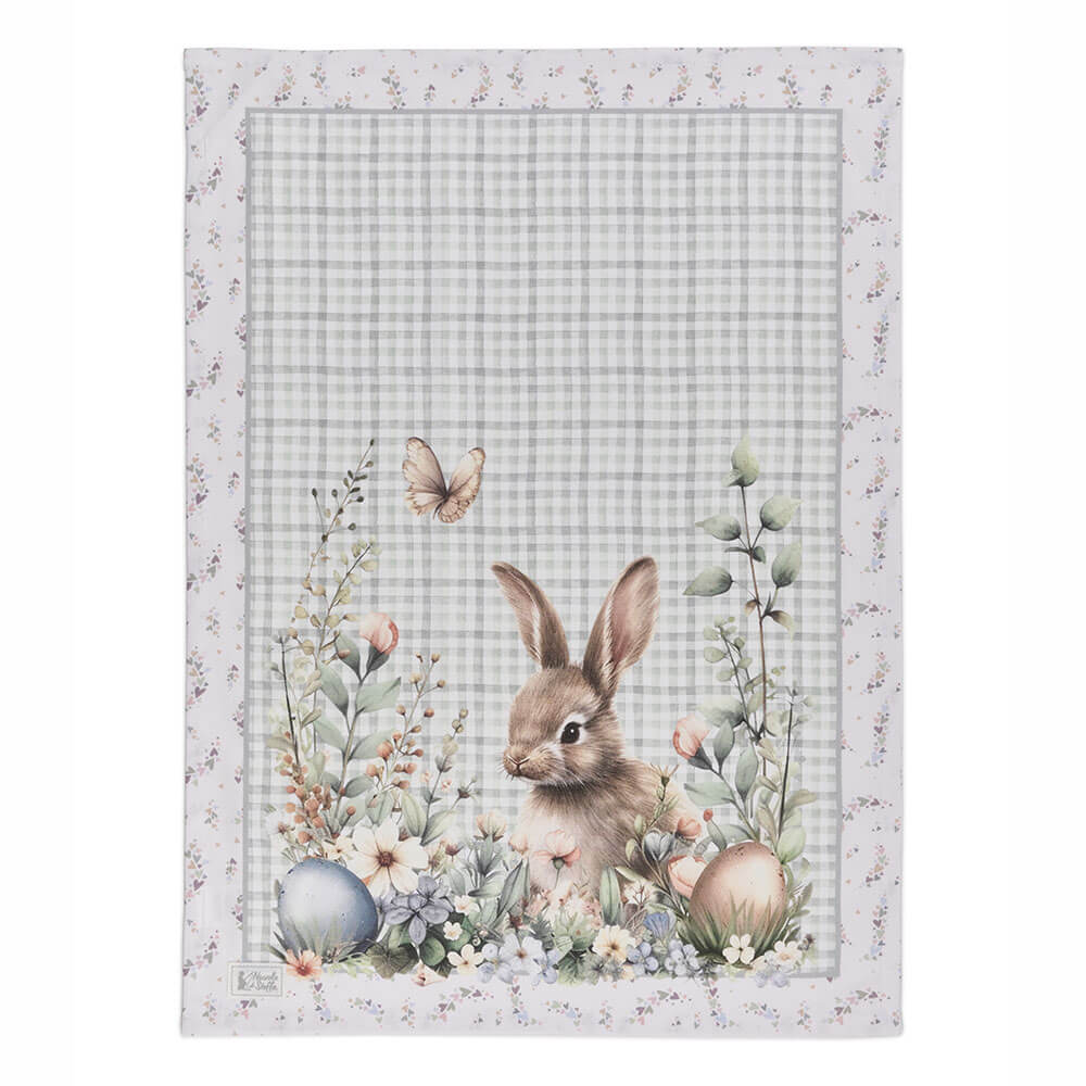 Paño de cocina de algodón Nuvole di Stoffa con conejo de Pascua, flores y huevos decorativos sobre un fondo de cuadros claros.