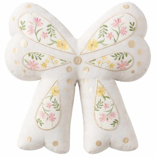 Cuscino a forma di fiocco bianco panna con inserti ricamati floreali e pois decorativi in cotone.