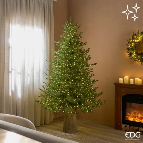 Pino di Natale verde con chioma realistica, 3.100 micro LED caldi e base decorativa effetto tronco.