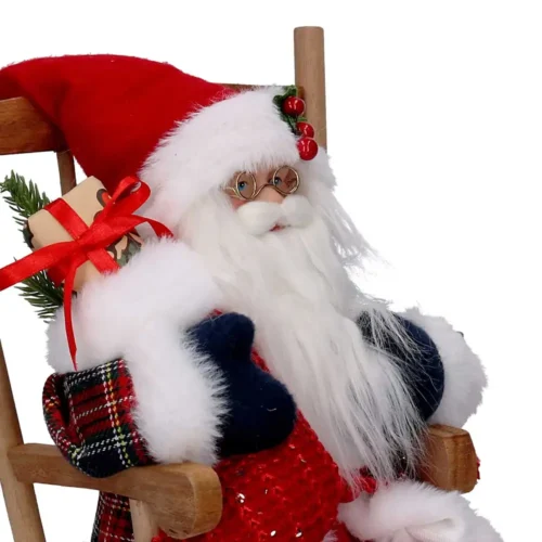 Babbo Natale su sedia a dondolo con dono H 30 cm - immagine 3