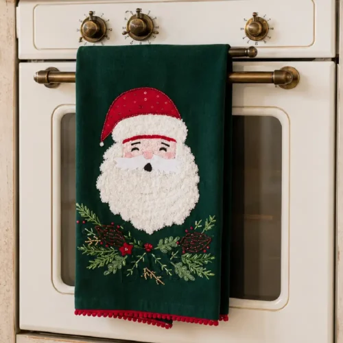 Canovaccio natalizio Blanc Mariclo verde bosco con volto di Babbo Natale, ghirlanda decorativa e bordo rosso.