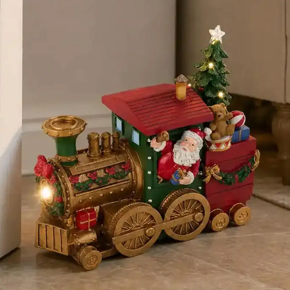 Locomotiva natalizia con Babbo Natale LED e musica 27 cm