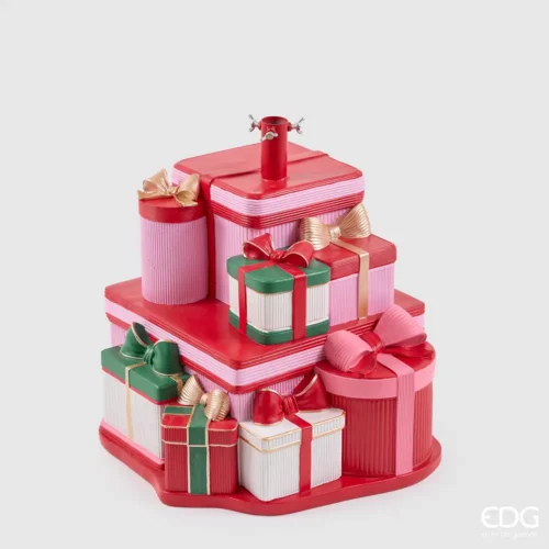Base per albero EDG con pacchi regalo sovrapposti rosa, rossi, verdi e bianchi, decorati con fiocchi dorati.