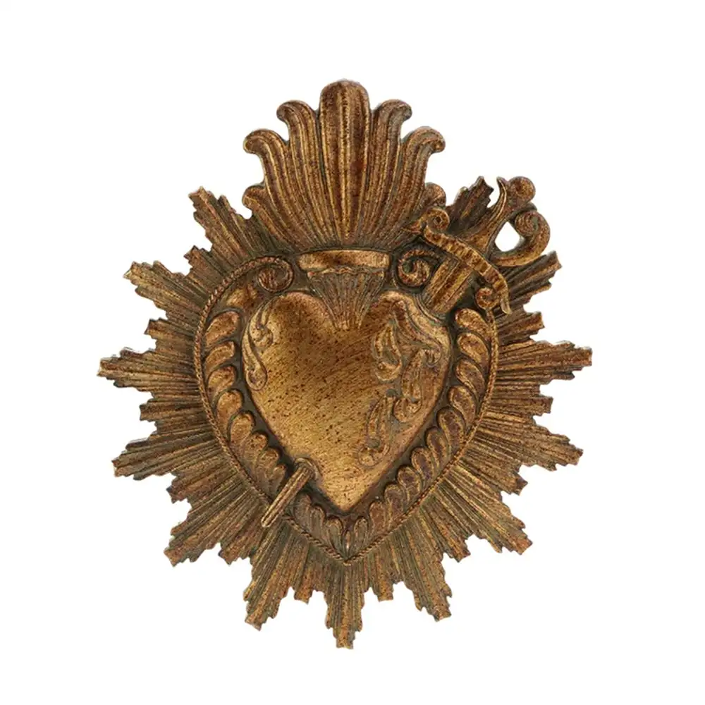 Cuore votivo Blanc Mariclò Vivienne in resina dorata anticata con raggi e decorazioni barocche in rilievo.