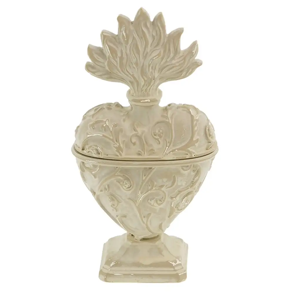 Cofanetto cuore votivo Blanc Mariclo Vivienne in resina avorio con decori in rilievo, fiamma superiore e base a piedistallo.