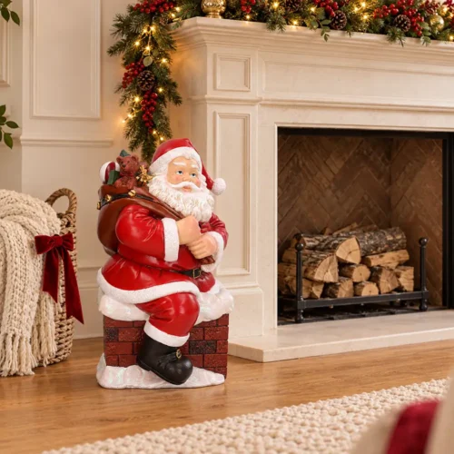 Babbo Natale in resina sul comignolo innevato con sacco regali H50 cm